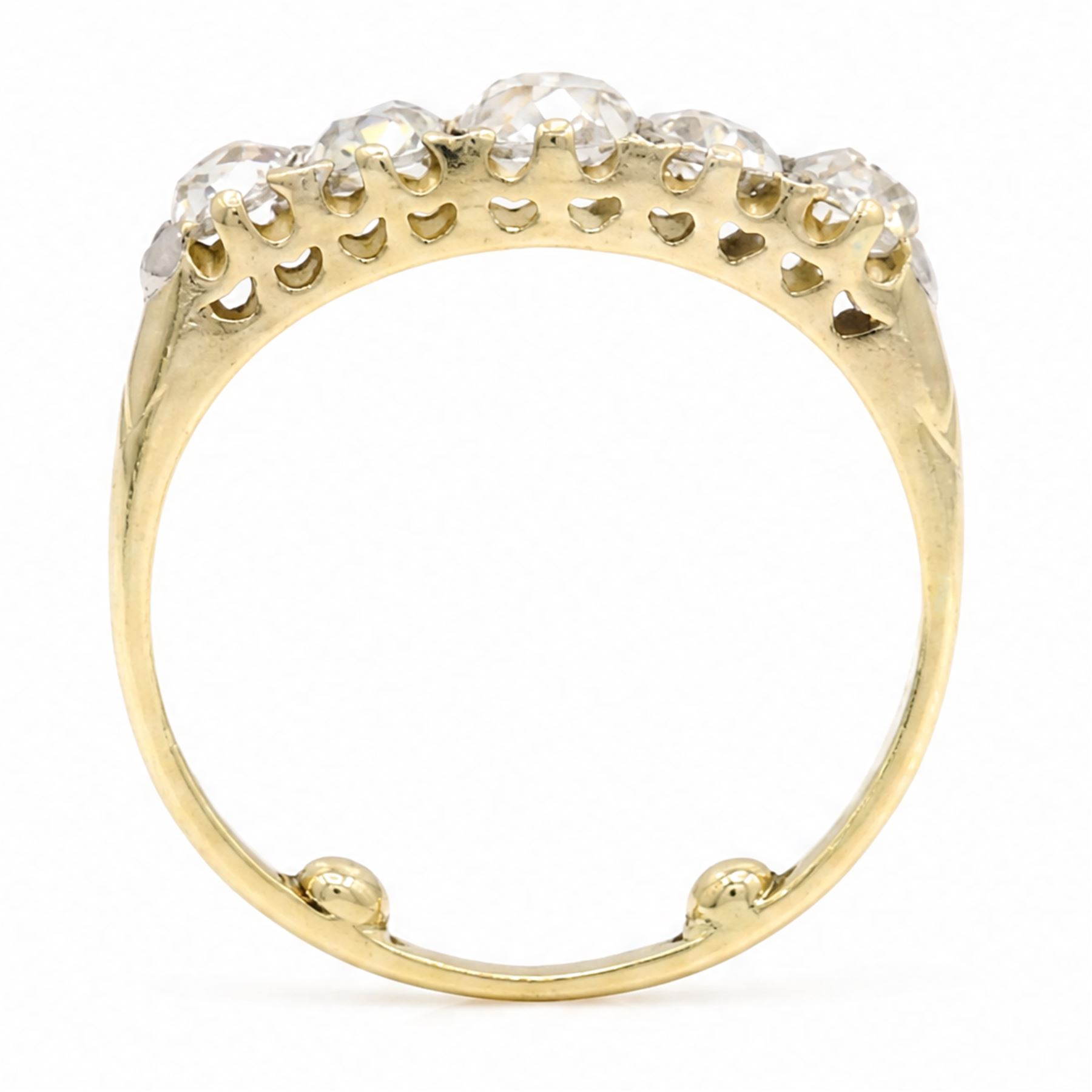 Early 20th century 18ct gold diamond ring, set with five graduating old cut diamonds and diamond accents, total diamond weight approx 1.55 carat