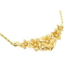 14ct gold diamond flower head necklace, five graduating flowers, each set with a single round brilliant cut diamond, on a rope twist chain necklace
