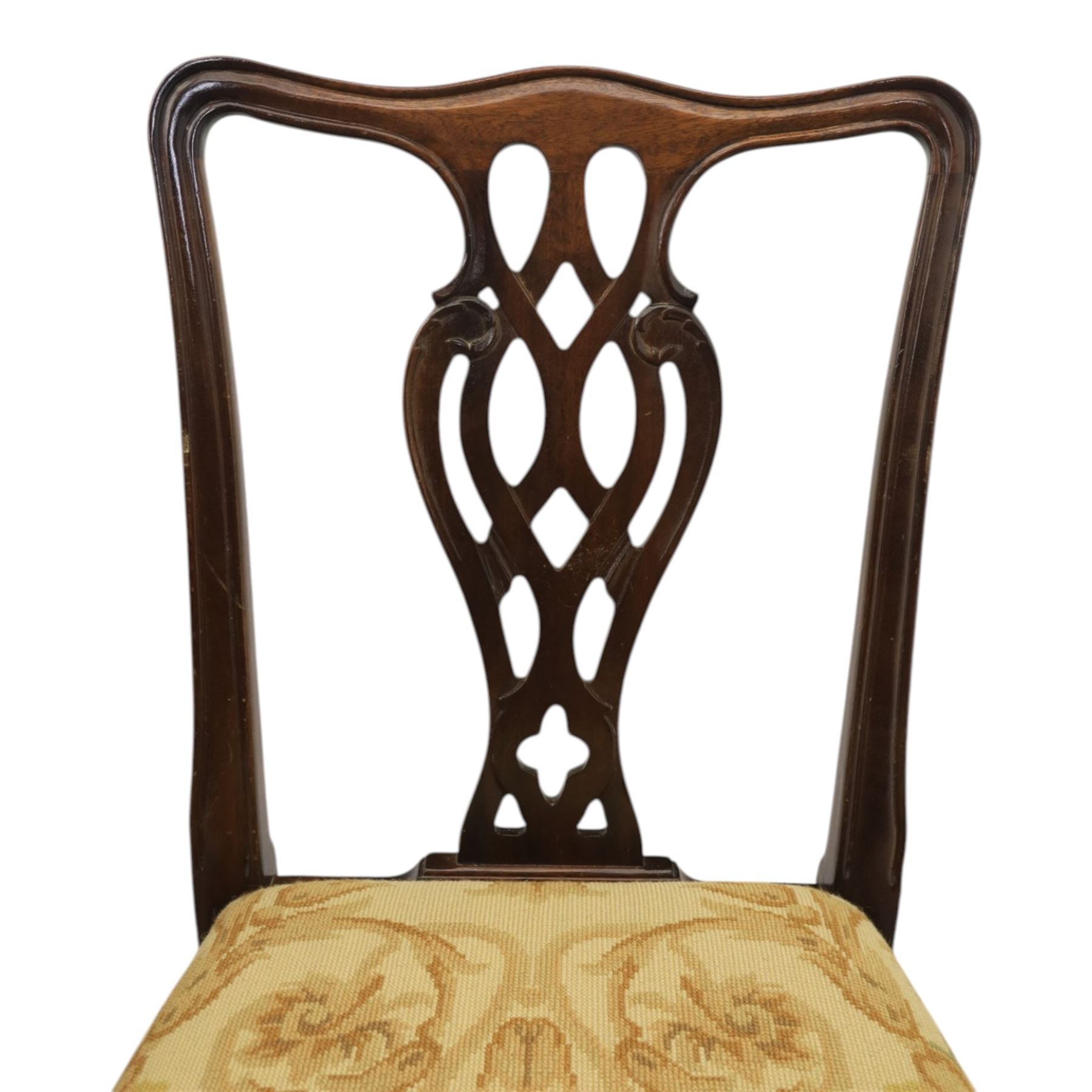 Large 19th century mahogany extending dining table with set of Chippendale design chairs, extending dining table with rectangular moulded top additional three leaves, raised on turned supports terminating in brass castors, the dining chairs (2 + 2) with shaped cresting rail and pierced splats, raised on square supports with stretchers
