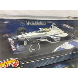 Five Mattel Hot Wheels 1:18 scale die-cast racing cars - Ferrari 248F1 Michael Schumacher, Renault F1 Team R25 Fernando Alonso, Williams F1 Team Williams FW28 Mark Webber, Jordan 199 Damon Hill and Williams F1 Team BMW; all boxed (5)