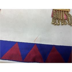 Two Masonic kid leather aprons, one with sash and cuffs, the other with sash, each marked 'Yorkshire North and East Ridings'; and three other unmarked Masonic aprons with sashes