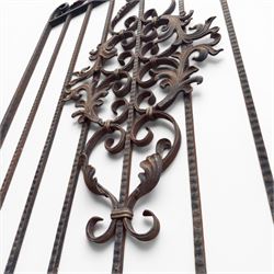 Victorian wrought iron vineyard gate, with ornate scrollwork and foliate acanthus leaf decoration, shaped cresting and central decorative panel, finished in rustic black painted finish