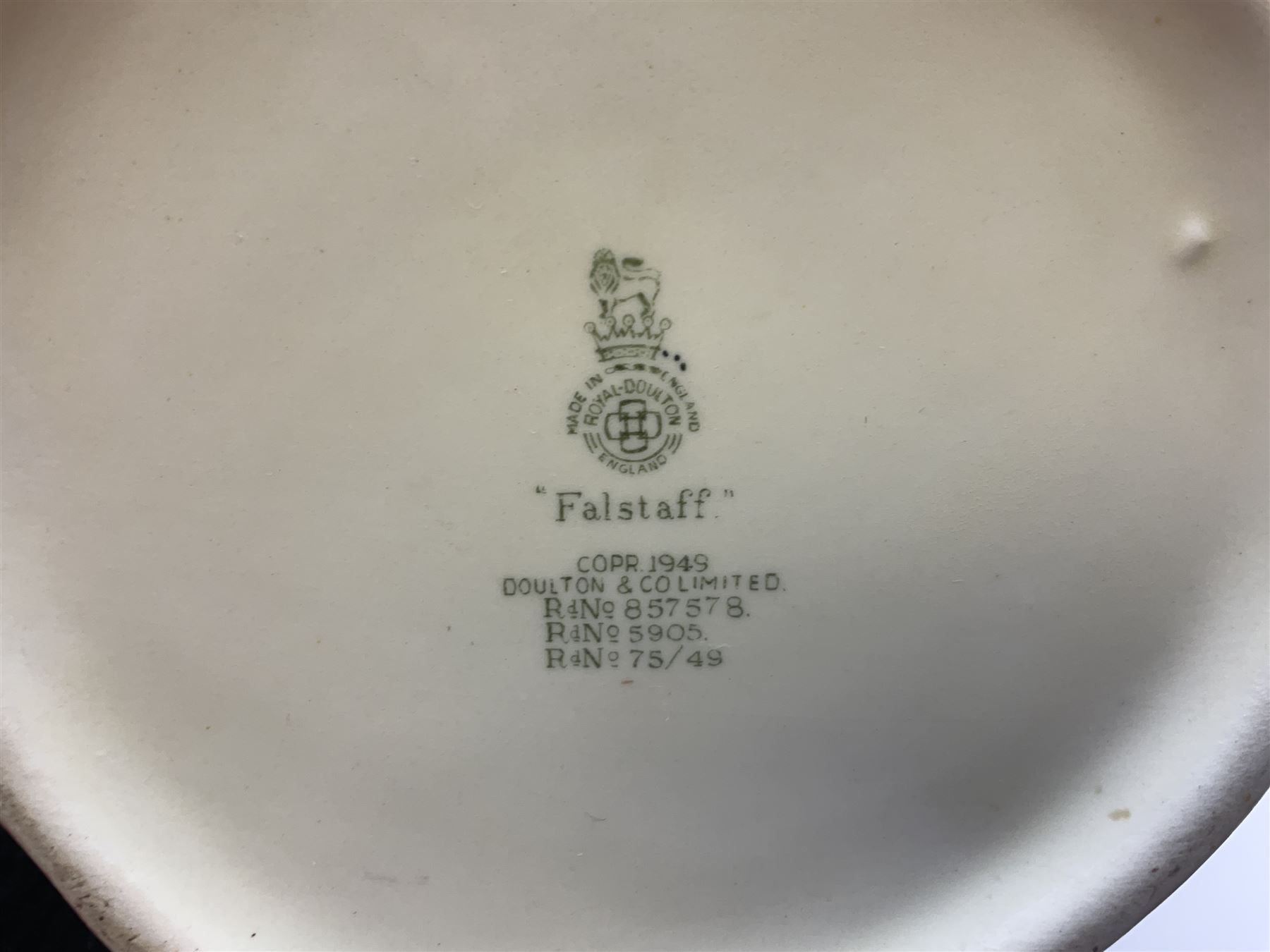 Royal Doulton toby jug of Winston Churchill H23cm and large character jug of Falstaff; together with four collector's plates by Royal Crown Derby, Royal Worcester and Limoges (6)