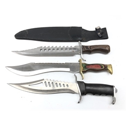  Large Rambo type knife, 30.5cm pierced saw back blade with shaped grip, L43.5cm in leather sheath, another with 27cm blade, another with 30cm saw back blade marked 410 Stainless Steel, with multicoloured grip, L43cm (3)  