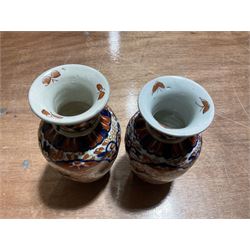 Two Japanese baluster vases decorated in the Imari palette, tallest H19.5cm