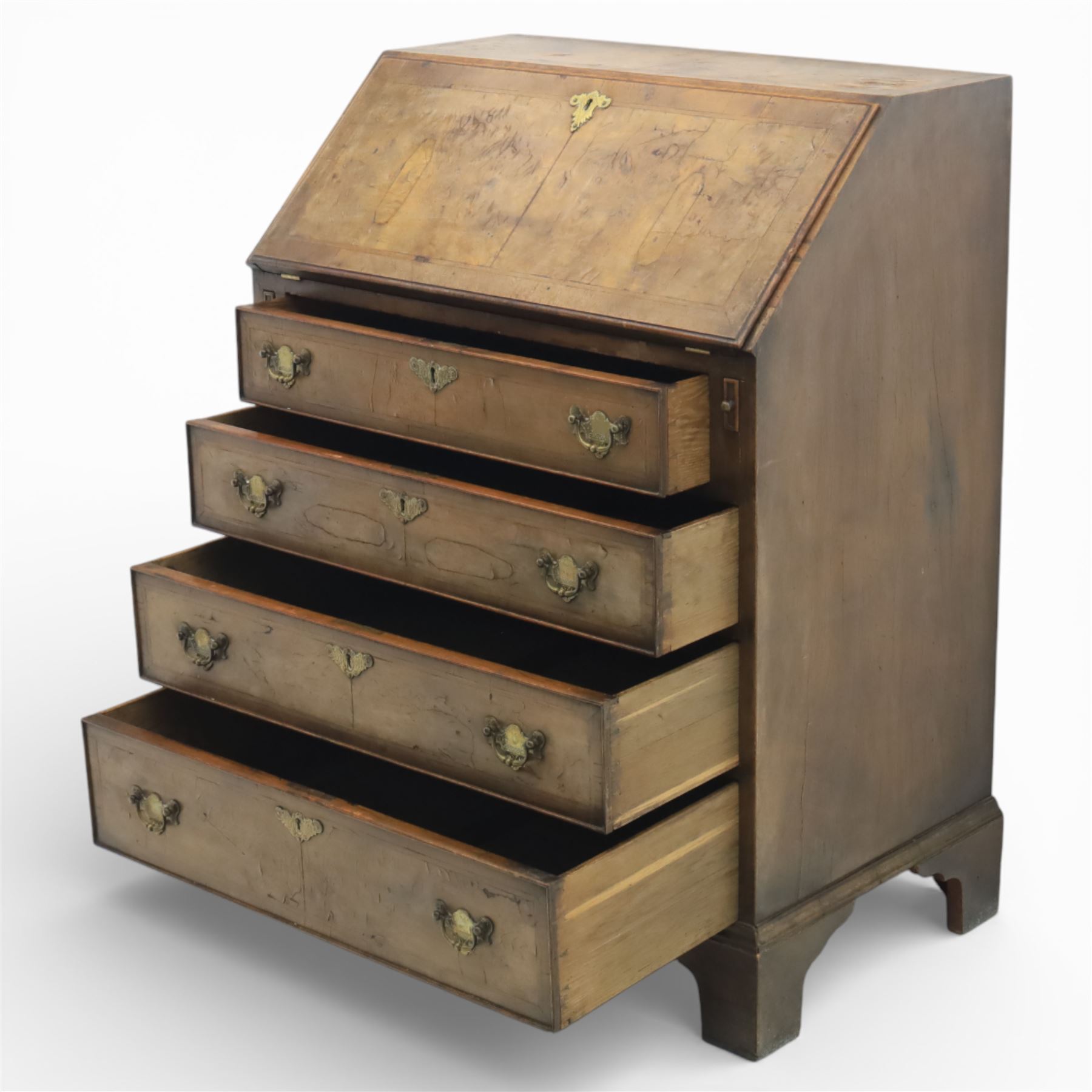 19th century walnut bureau of small proportions, the sloping fall enclosing a fitted interior with shaped pigeonholes and small drawers, above four long graduated drawers with feather banded walnut veneers, fitted with brass swan neck handles and escutcheons, raised on shaped bracket feet