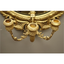  20th century ornate gilt wood and gesso framed oval mirror with three candle sconces, scrolling foliage and shell pediment, W59cm H99cm  