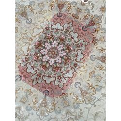Persian Mahal densely knotted ivory ground carpet, floral rosette medallion surrounded by interlacing leafy branches and palmettes, scrolling border decorated with foliate motifs, within guard stripes, with signature panels to each end