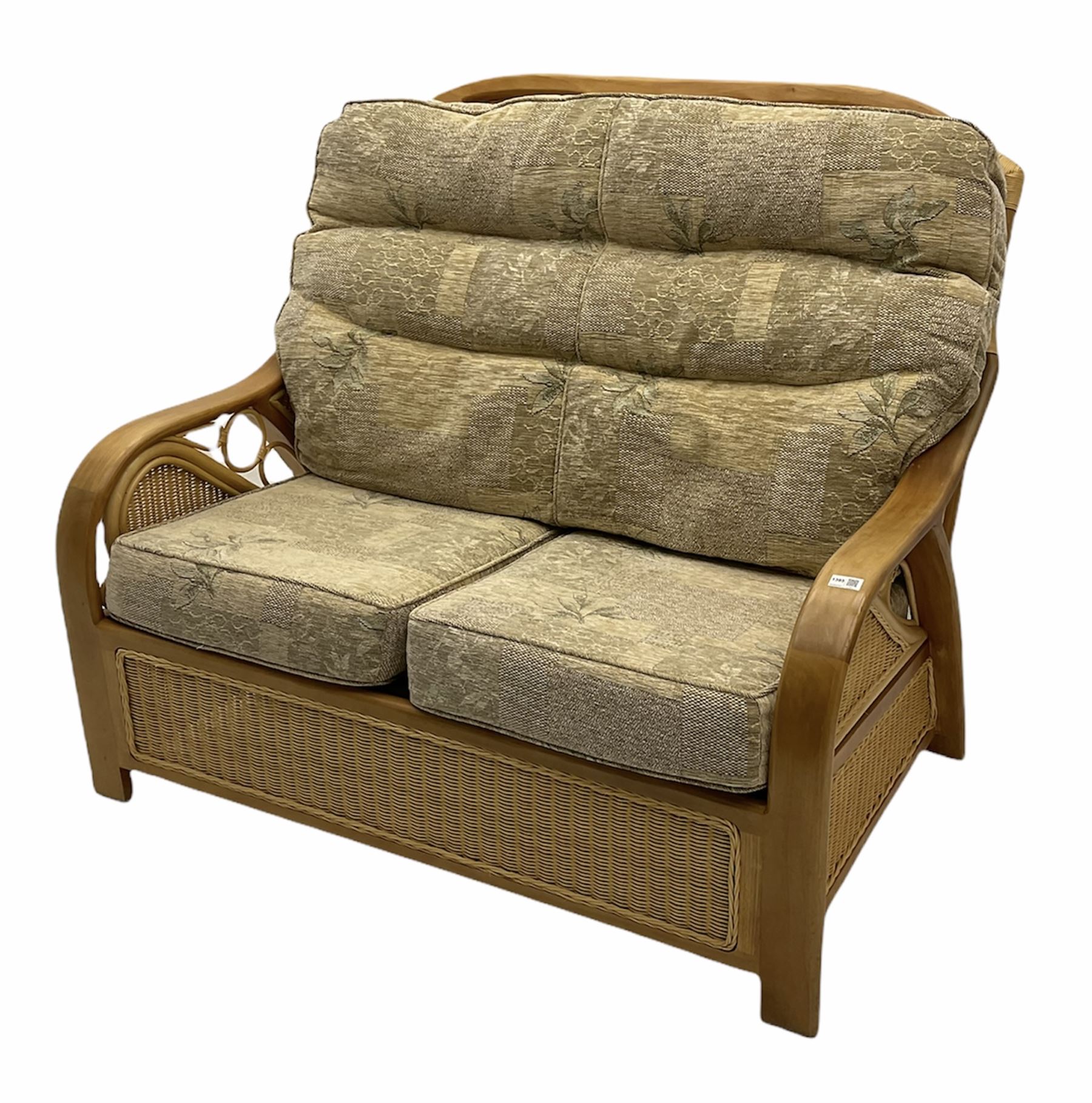 Light wood and cane two seat conservatory sofa, loose beige patterned cushions