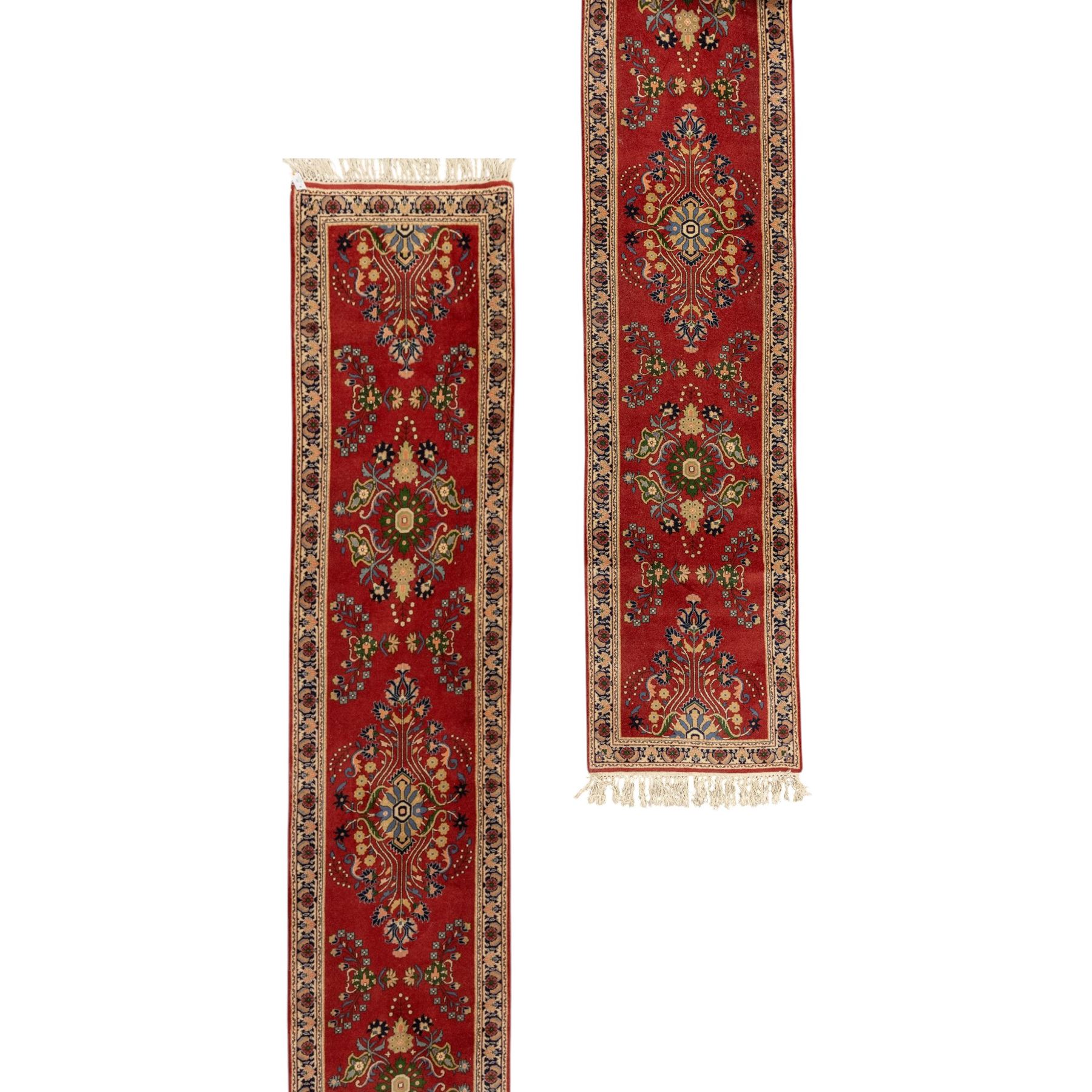 Kashan design wool runner, red field decorated with repeating floral medallions, palmettes and scrolling foliate motifs, enclosed by cream floral border and fringed ends