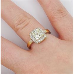 18ct gold diamond cluster ring, the central princess cut light yellow diamond of approx 1.00 carat, with round brilliant cut white diamond surround, total diamond weight 1.31 carat
