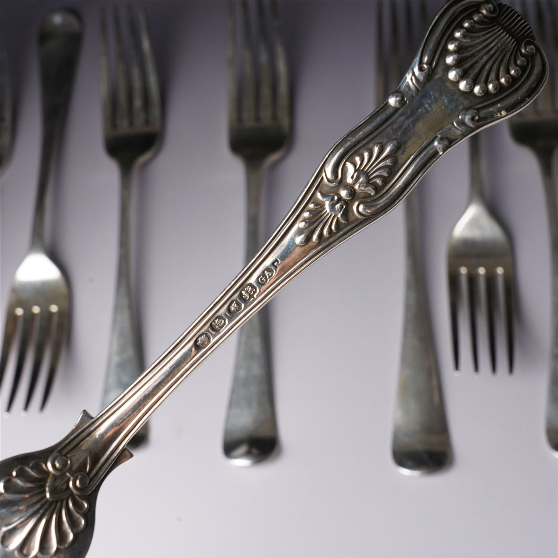Pair of George IV silver fiddle, thread and shell pattern table forks Lonson 1826 and ten other 19th century silver table forks, various dates and makers (12)