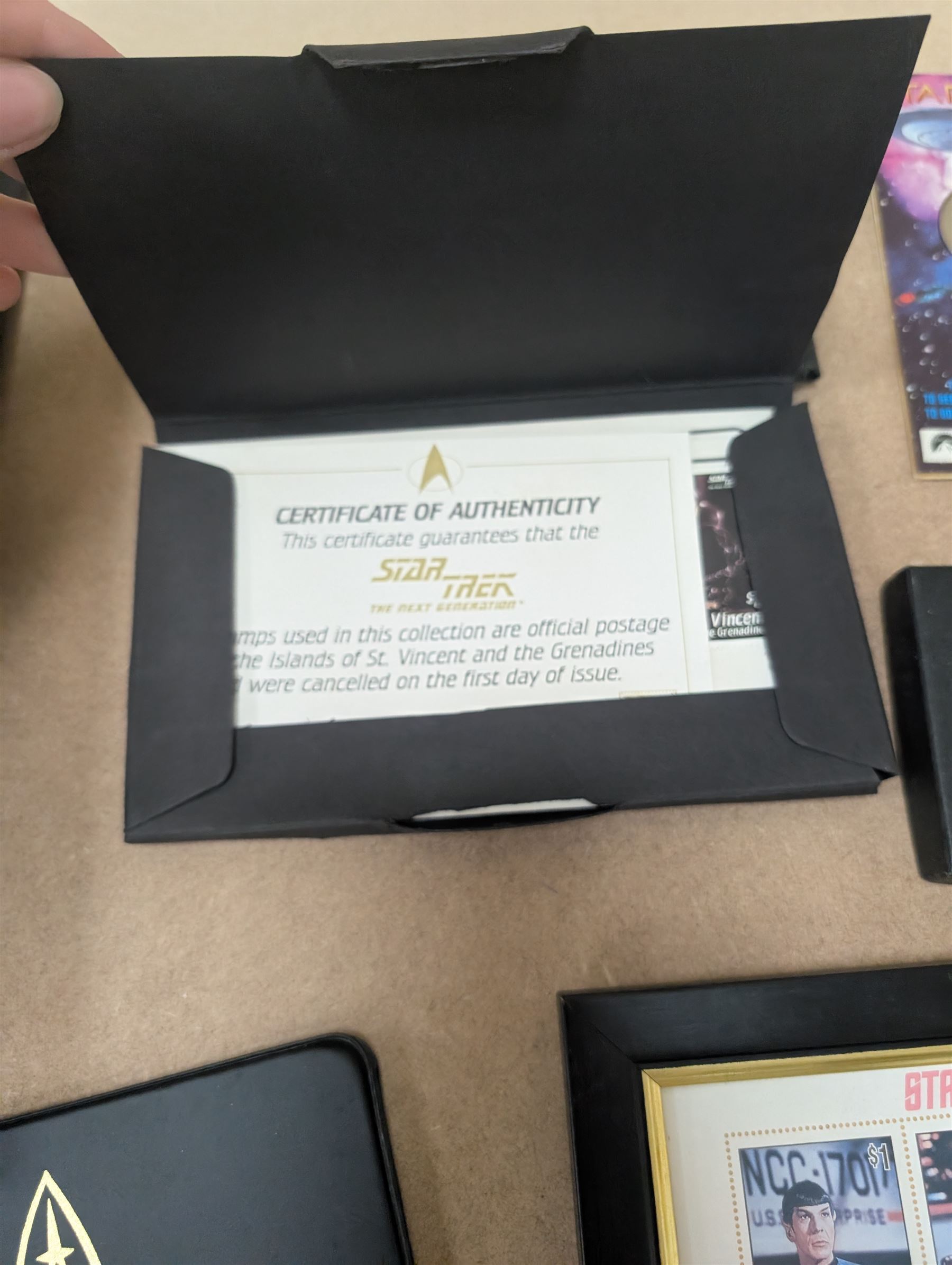 Star Trek collectables, including Danbury Mint '22ct Gold Card Collection', PCS Stamps and Coins Official US Postage Celebrating The Original Star Trek Series, Star Trek St Vincent and Grenadines first day cover collection, four stamp sets and a framed set of similar stamps, commemorative coins, Star Trek The Experience Las Vegas coin, three commemorative 'gold stamps' and three albums of collectors cards and telephone cards
