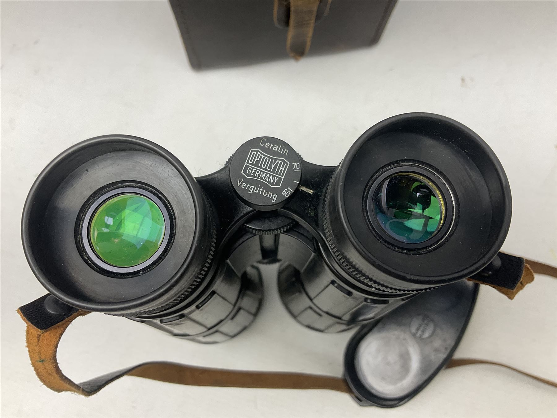 Pair of Optolyth 12 x 63 binoculars, made in Germany, serial no 82186, in leather case