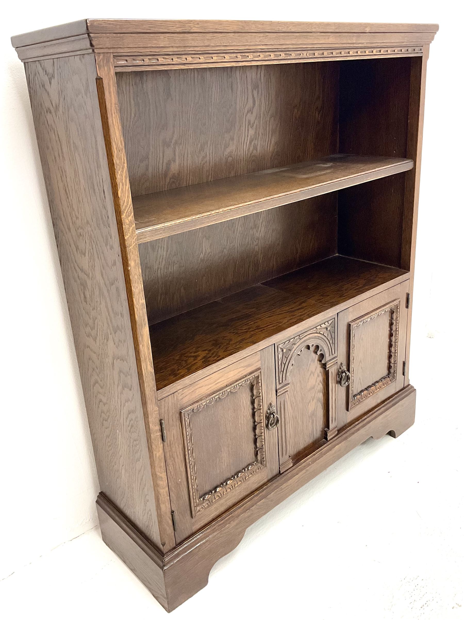 Mid 20th century oak open bookcase, single shelf above two base