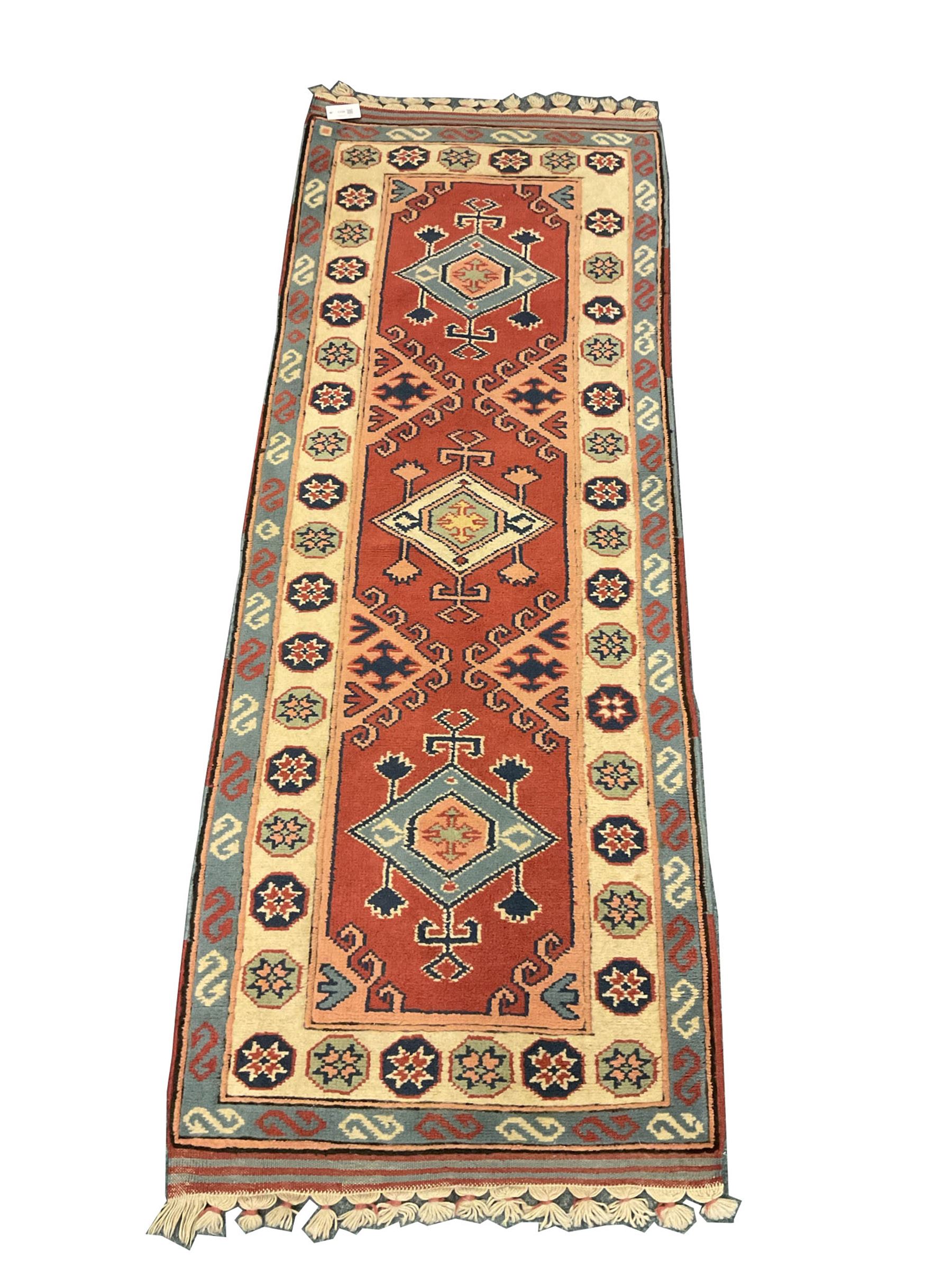 Turkish style runner rug, triple medallion surrounded by red field