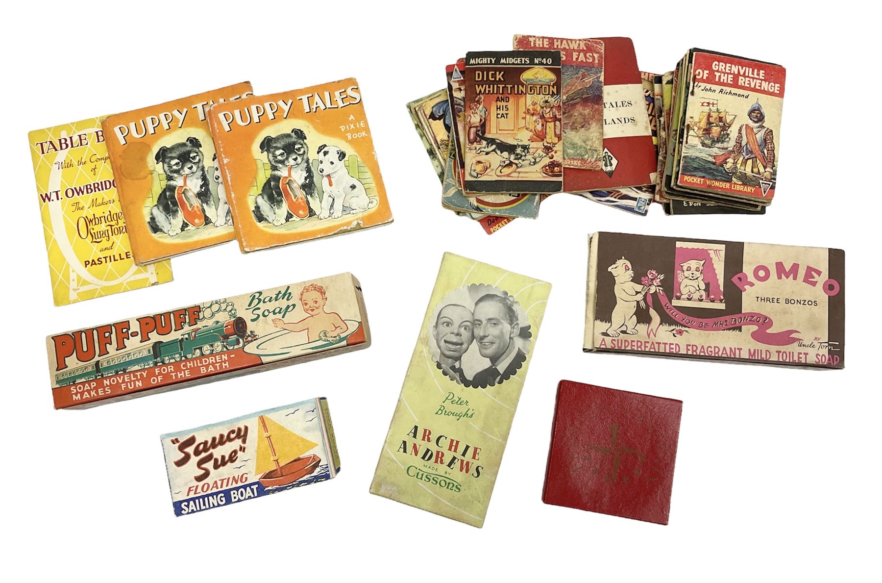 Five novelty soap, comprising Archie Andrews, Three Bonzos, Saucy Sue, Puff Puff bath soap, Festival of Britain 1951, together with pocket wonder library books