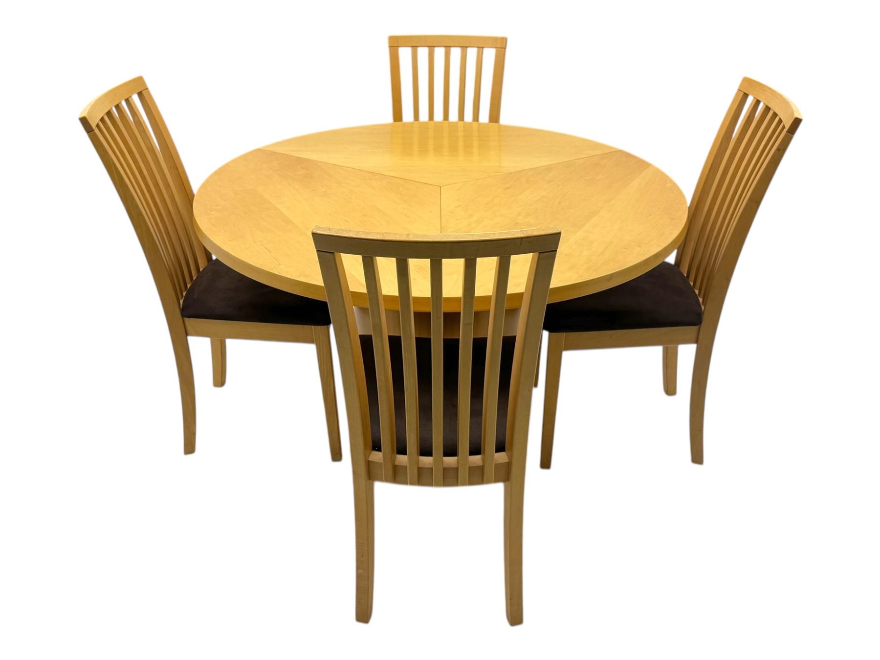Skovby - 'SM32' late 20th century beech circular extending dining table circular segmented top turning to activate a patented spring loaded triple leaf extension stored within the cylindrical column base (Extended diameter 146cm); and set of four chairs (Width 47cm, Depth 56cm, Height 95cm, Seat height 47cm)