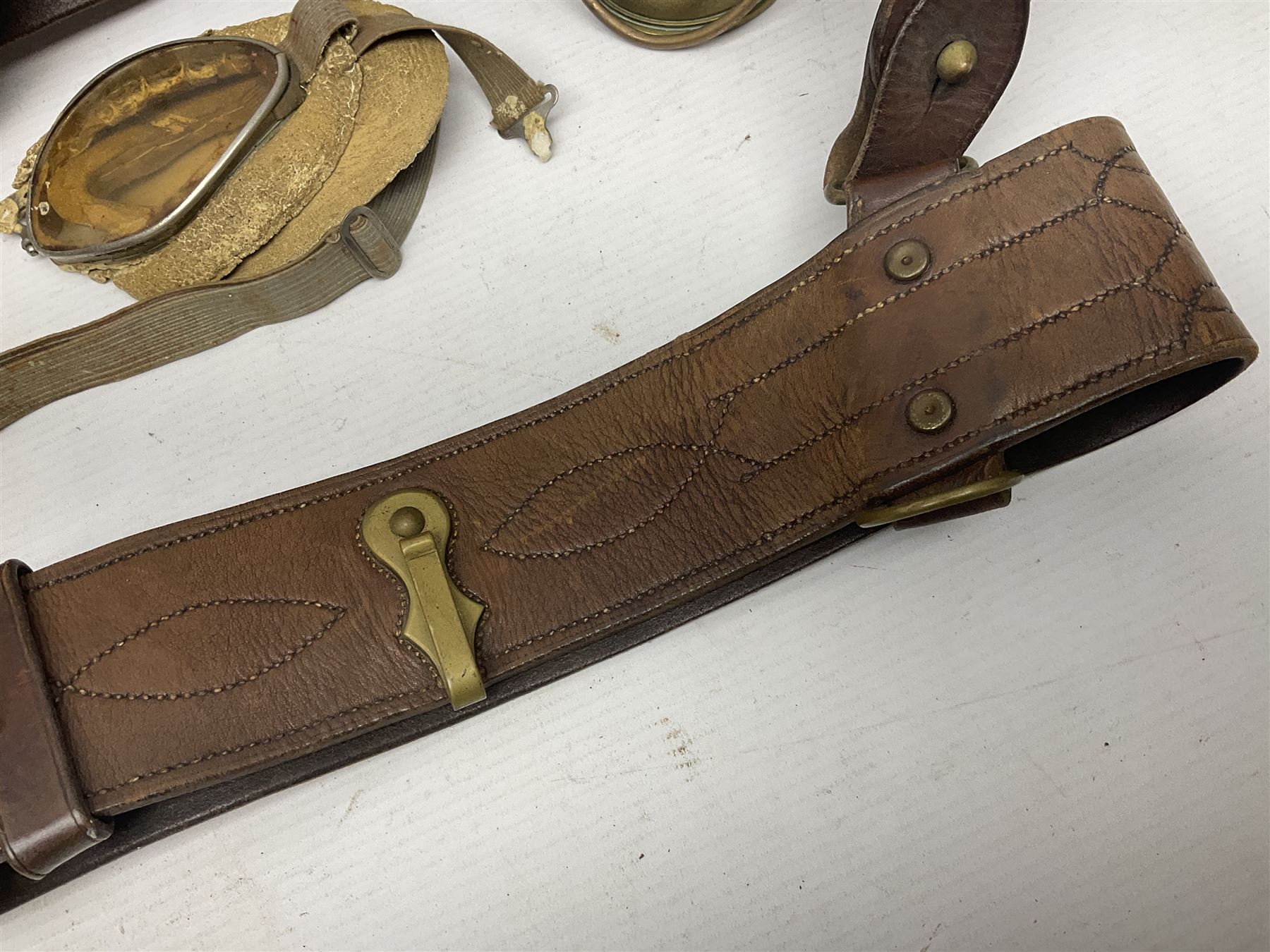 British Army Sam Brown leather belt with Turkish markings; New Zealand Land Forces officer's commission certificate dated 1919; WWII small pair of trench art brass helmet shaped scuttles; and other items