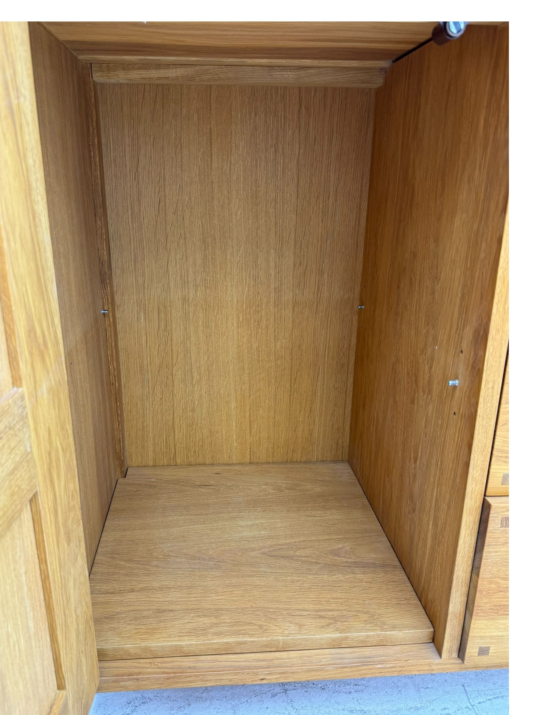 Laura Ashley - 'Milton' light oak sideboard, fitted with four central drawers flanked by two panelled cupboards, on square supports