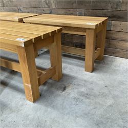 Three small light oak benches and a large bench