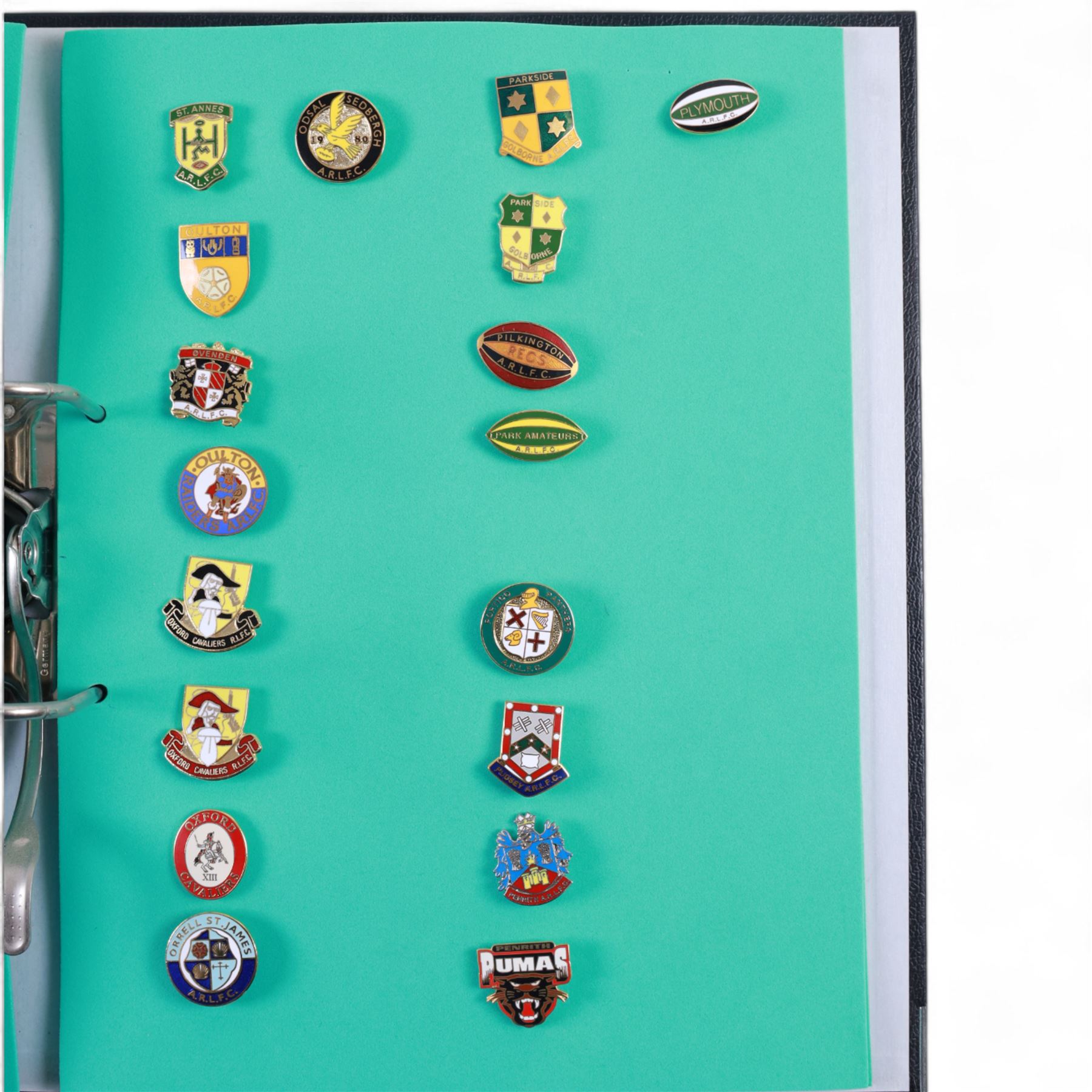 Amateur rugby league enamel badge collection, teams including Birmingham Bulldogs, Bridlington, Dudley Hill, Duke of York, Edinburgh Eagles, Guiseley, Rangers, Huntingdon, Keighley Town, Leigh Miners, Pilkington Recs, St Josephs, Thornhill Trojans, West London Sharks etc, all displayed in three folders and six amateur league badges from Leeds & District, Hull & District, York & District, Warrington, Lancashire County and Yorks County in box display, (approximately 270)