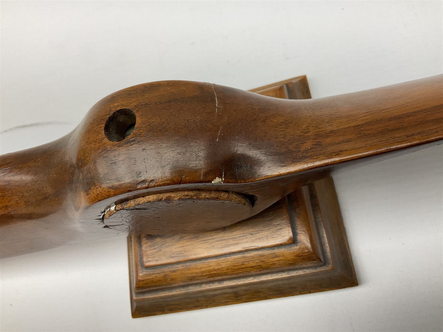Early 20th century novelty small propeller mantle clock reputedly made by an apprentice at Blackburn Aircraft Works, Beverley & Hull in 1914, the mahogany case loosely inset with a WW1 DOXA Royal Flying Corps pocket watch, the black dial inscribed ' 30-Hour Non-Luminous Mark V.' number BE11653 with subsidiary seconds dial, the back marked with a capital 'A' above a broad arrow, mounted on a stepped square base L67cm