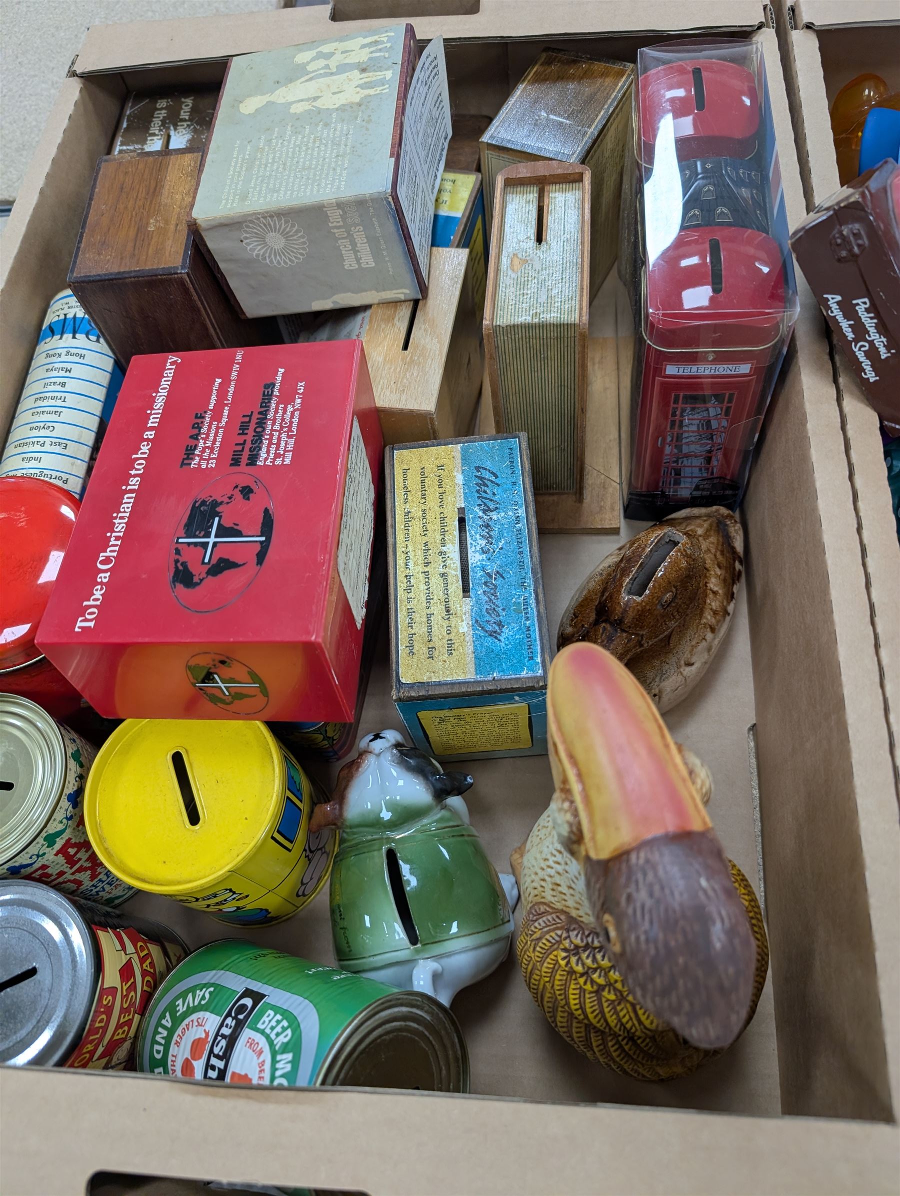 Large collection of vintage money boxes and charity boxes, including plastic, wooden, tin and ceramic examples, of various designs including Paddington, Dunlop, Jellybabies, Meerkat, Halifax Houses, Pigs, etc