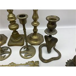 Brass inkstand, of square form, pierced, inset with blue and white ceramic inkwell to centre, together with a collation of brass candlesticks 