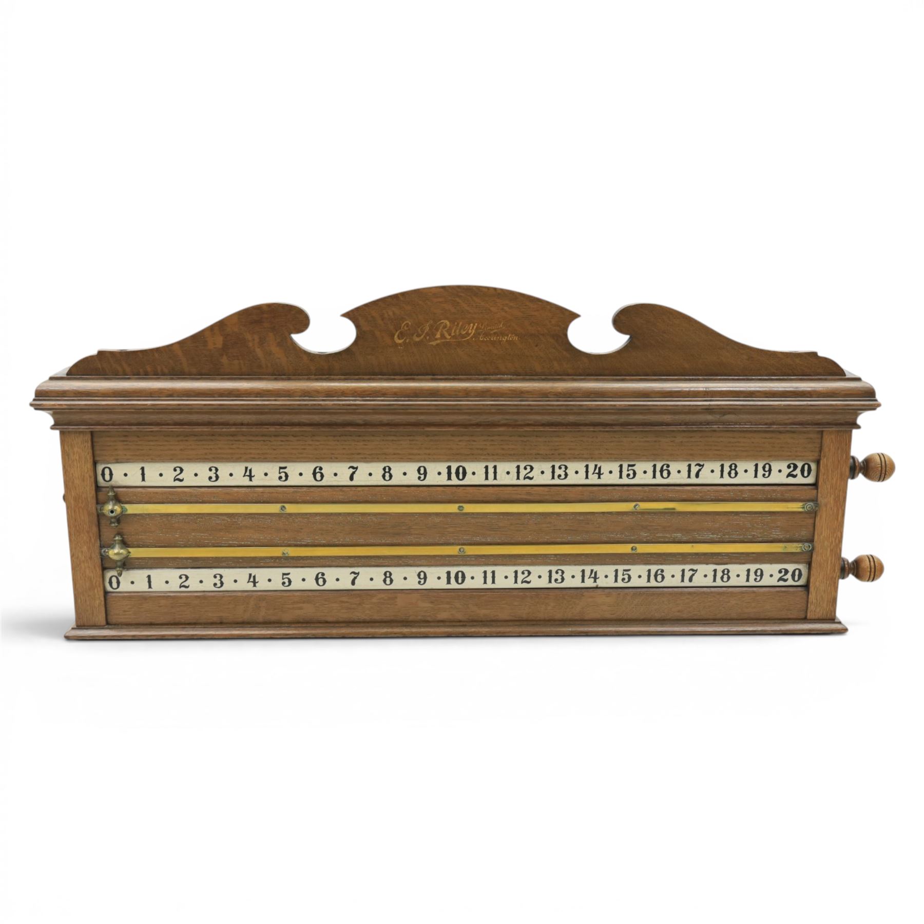 E.J. Riley - 20th century oak billiards scorer, with broken arch pediment with gilt markers mark, with revoling scorer with turned knob, brass indicator, with brass wall hangers