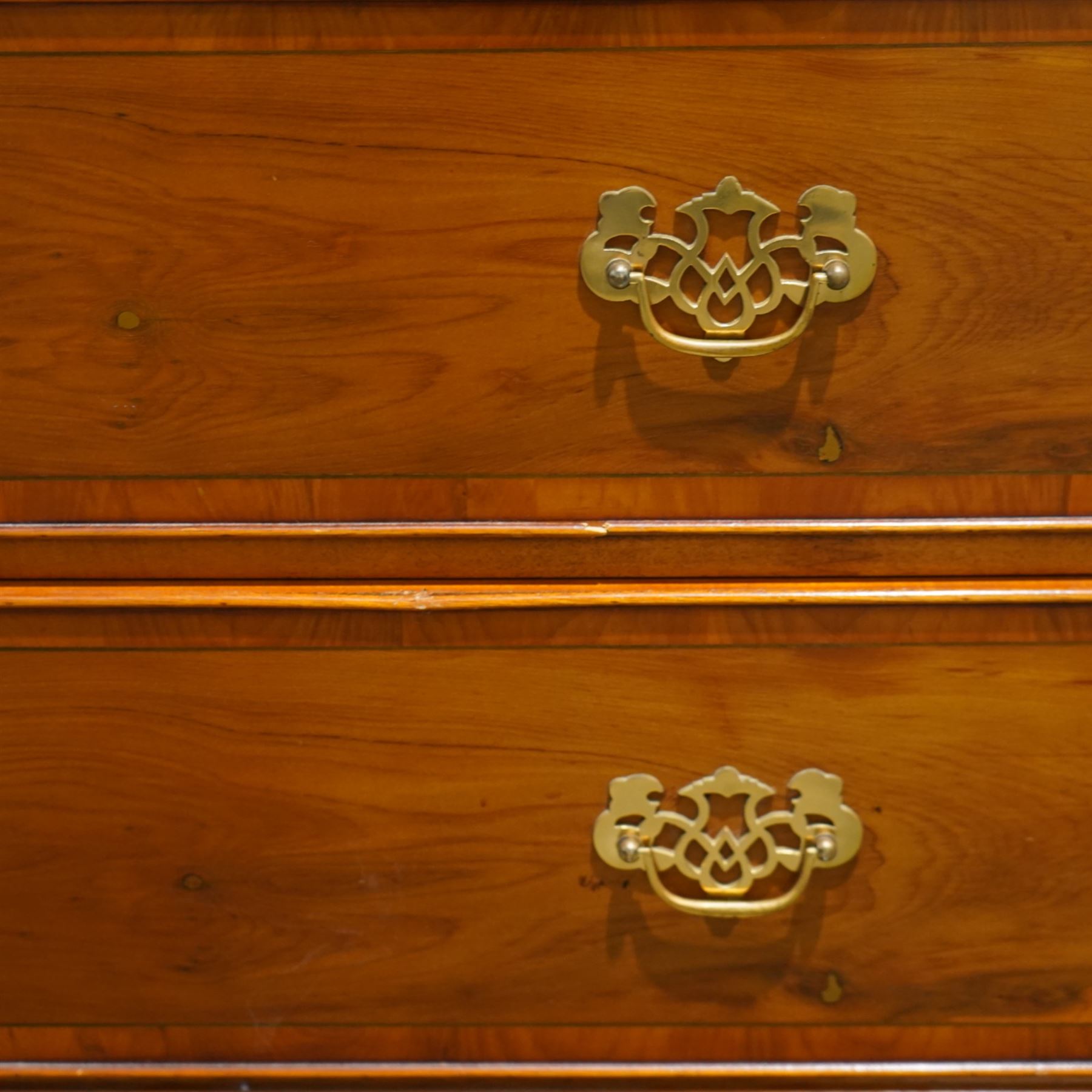 Late 20th century pair of yew wood chests of drawers, each with rectangular tops above two short over two long drawers, cockbeaded drawer fronts fitted with brass swan neck handles, raised on bracket feet
