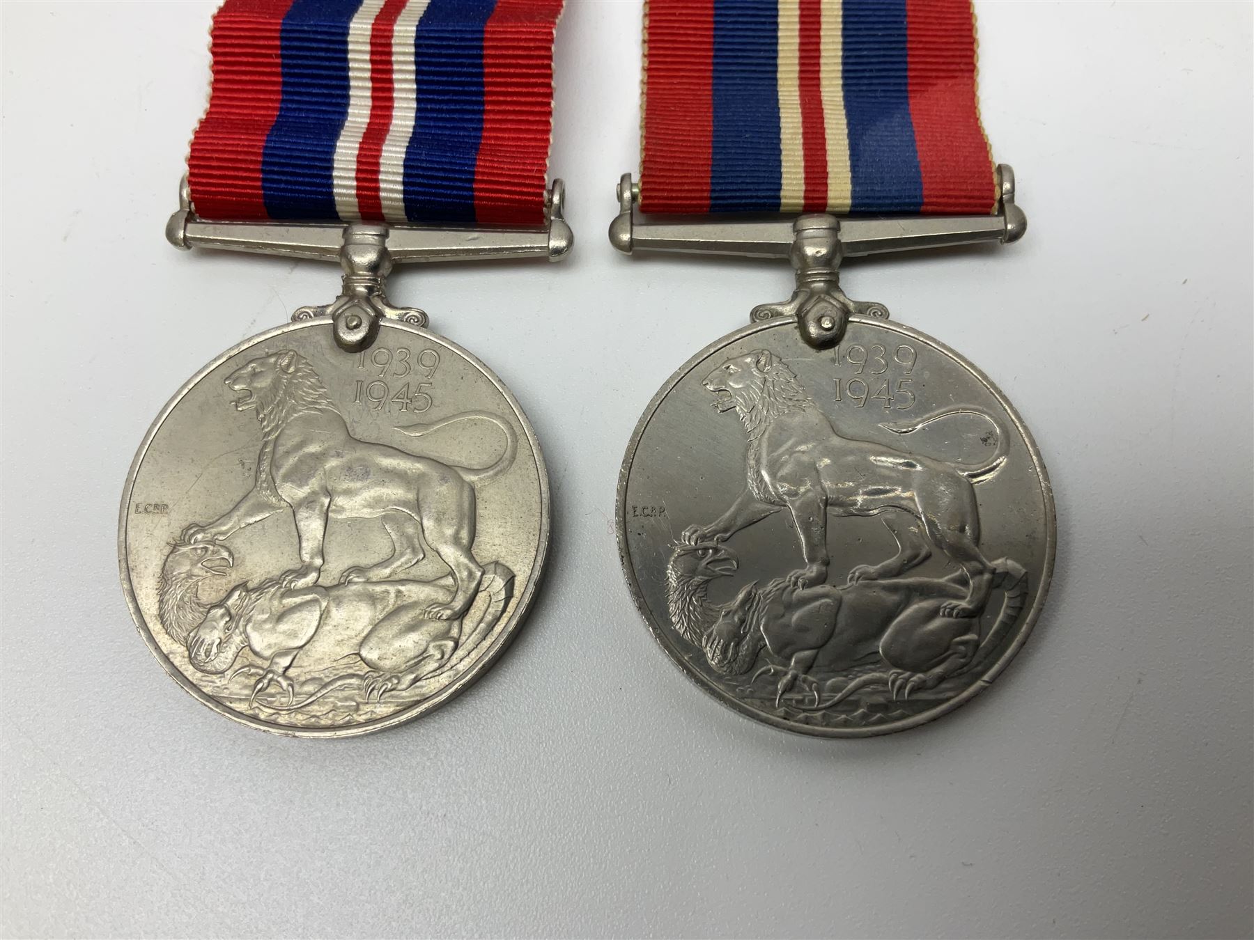 Ten WW2 medals comprising two 1939-1945 war medals, two Defence medals, two 1939-1945 Stars, two Africa Stars, France & Germany Star and Burma Star; together with bar of four miniature medals; all with ribbons