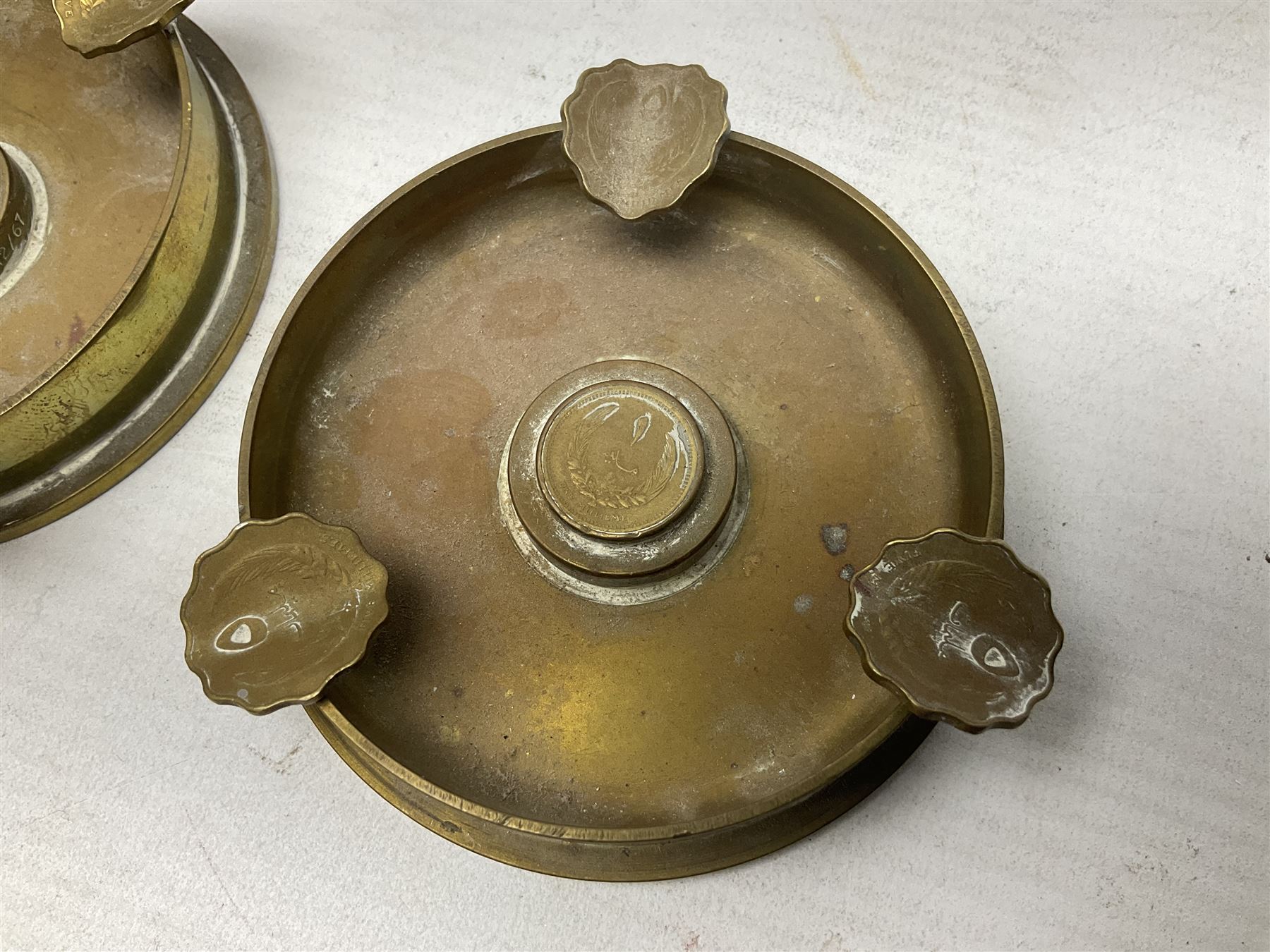 Four post-WW2 'silver' medallions of Adolf Hitler/German interest, two depicting Von Hindenburg also; and pair of 1960s trench art shell case bases as ashtrays mounted with Libyan Five Milliemes coins as cigarette rests (6)