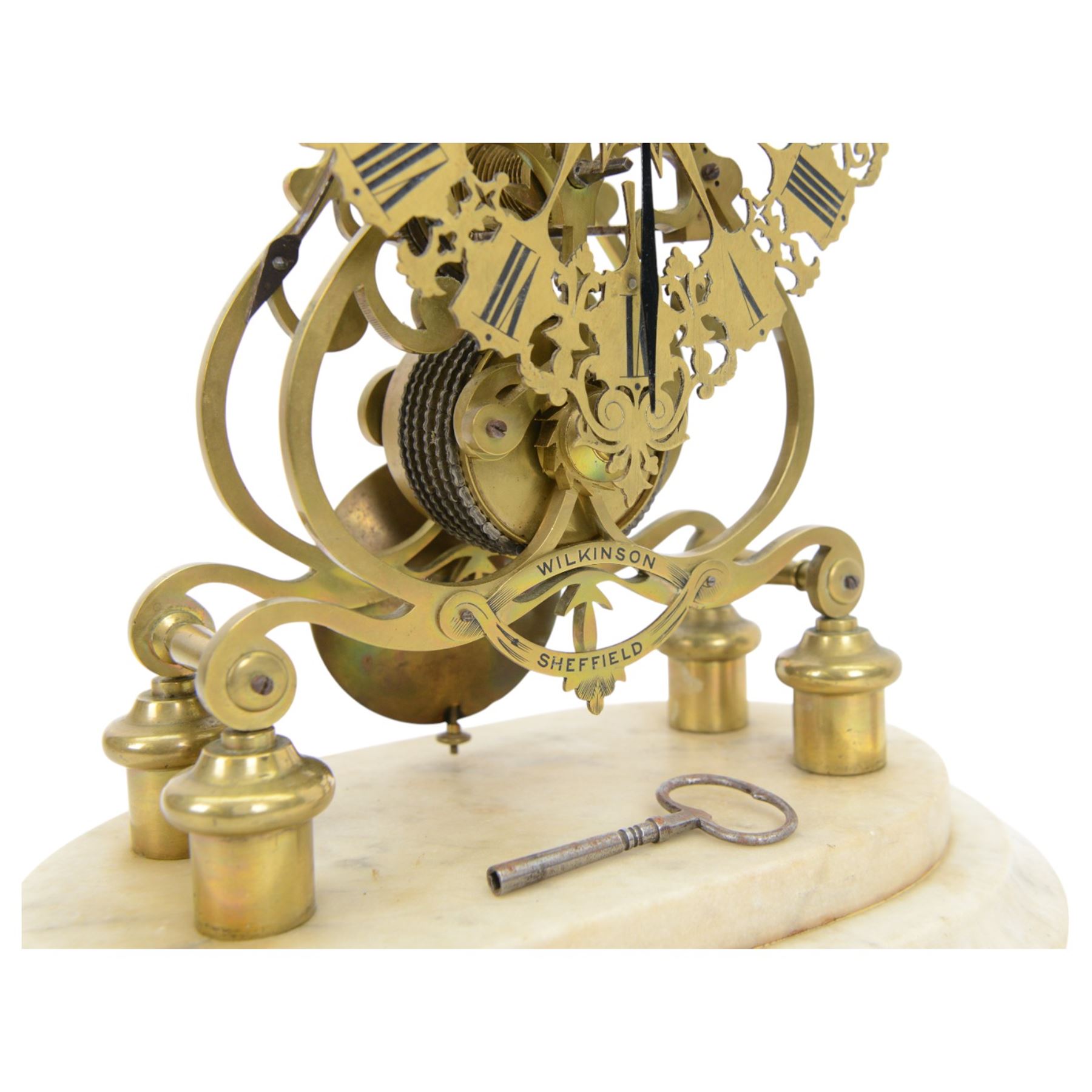 Joseph Wilkinson of South Street, Sheffield - single train 8-day skeleton clock c1860, mounted on an oval stepped white marble base with bun feet, finely pierced and fretted dial with engraved Roman numerals each on a shield background, scroll pattern five pillar frames engraved with the retailers name and surmounted by a silvered bell and spire, chain driven fusee movement with five spoke wheels, deadbeat escapement and passing single strike on the hour. With key and pendulum.