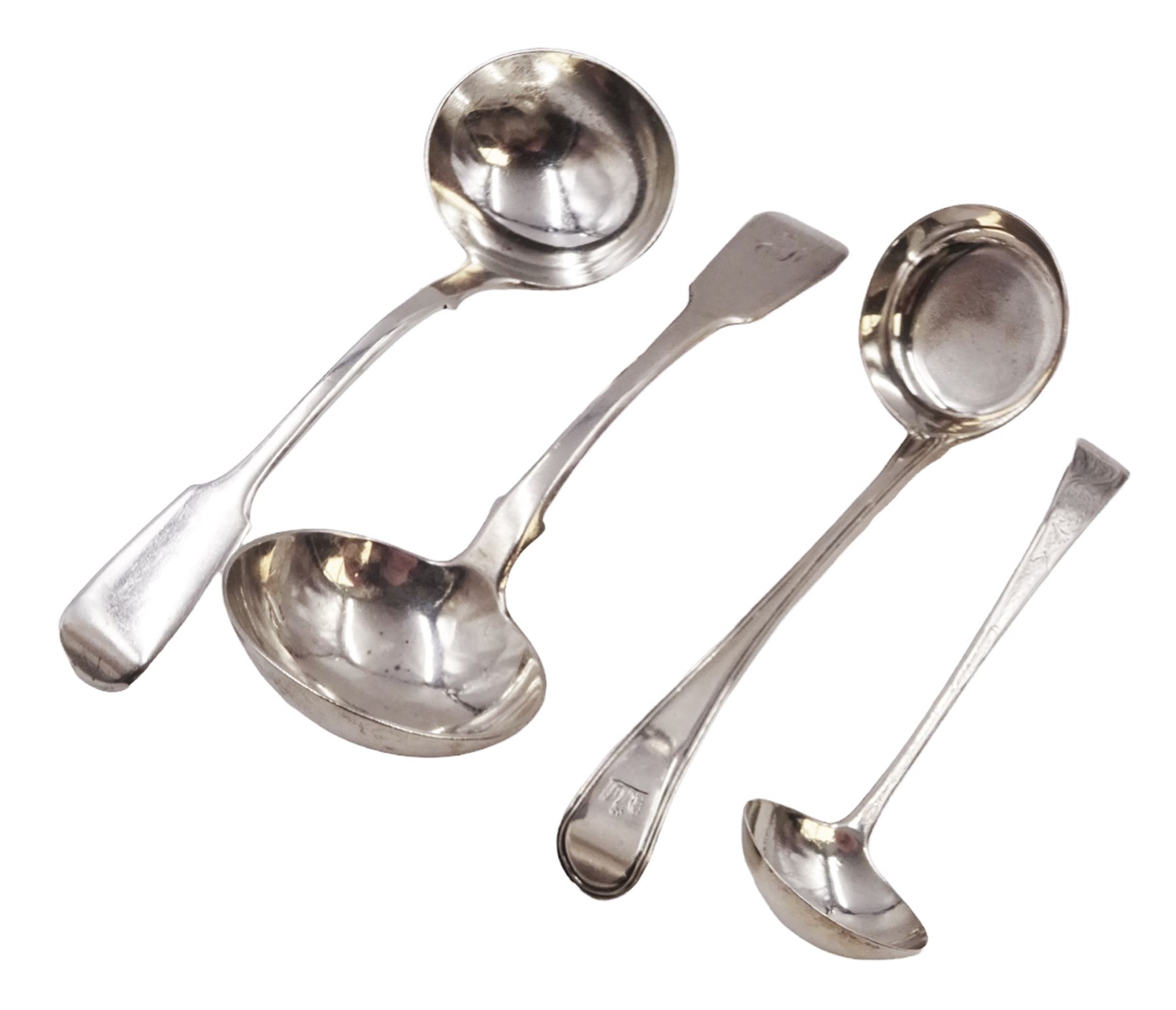 George III Old English pattern sauce ladle, with engraved crest and foliate decoration front and verso, hallmarked George Smith (IV), London 1799, together with an Old English pattern toddy ladle, with reed border and engraved griffin crest, hallmarked London 1824, maker's mark WC, probably William Chawner II, and two silver Fiddle pattern sauce ladles, the first example hallmarked London 1835, maker's mark worn and indistinct, and the second example hallmarked Charles Shipway, London 1837