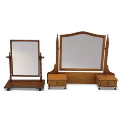 Two early 20th century mahogany swing dressing mirrors, comprising one with arched rectang...