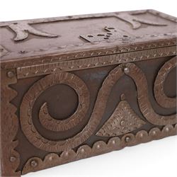 Late 19th/early 20th century vernacular iron box, the hinged cover and sides with applied strapwork decoration, the cover with applied church motif, H11.5cm W22cm D12cm