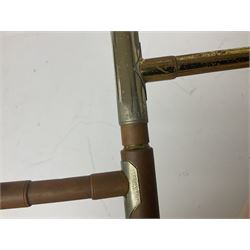 Three brass trombones comprising Elkhart Ind. USA 'CONN' model no.72H; Besson 'Concord'; and Selmer Distributed 'Lincoln'; two in carrying cases; and German B & M 'Champion' brass trumpet (4)