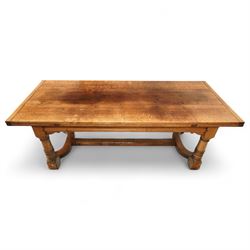 17th century design oak refectory extending dining table, the rectangular planked top with...