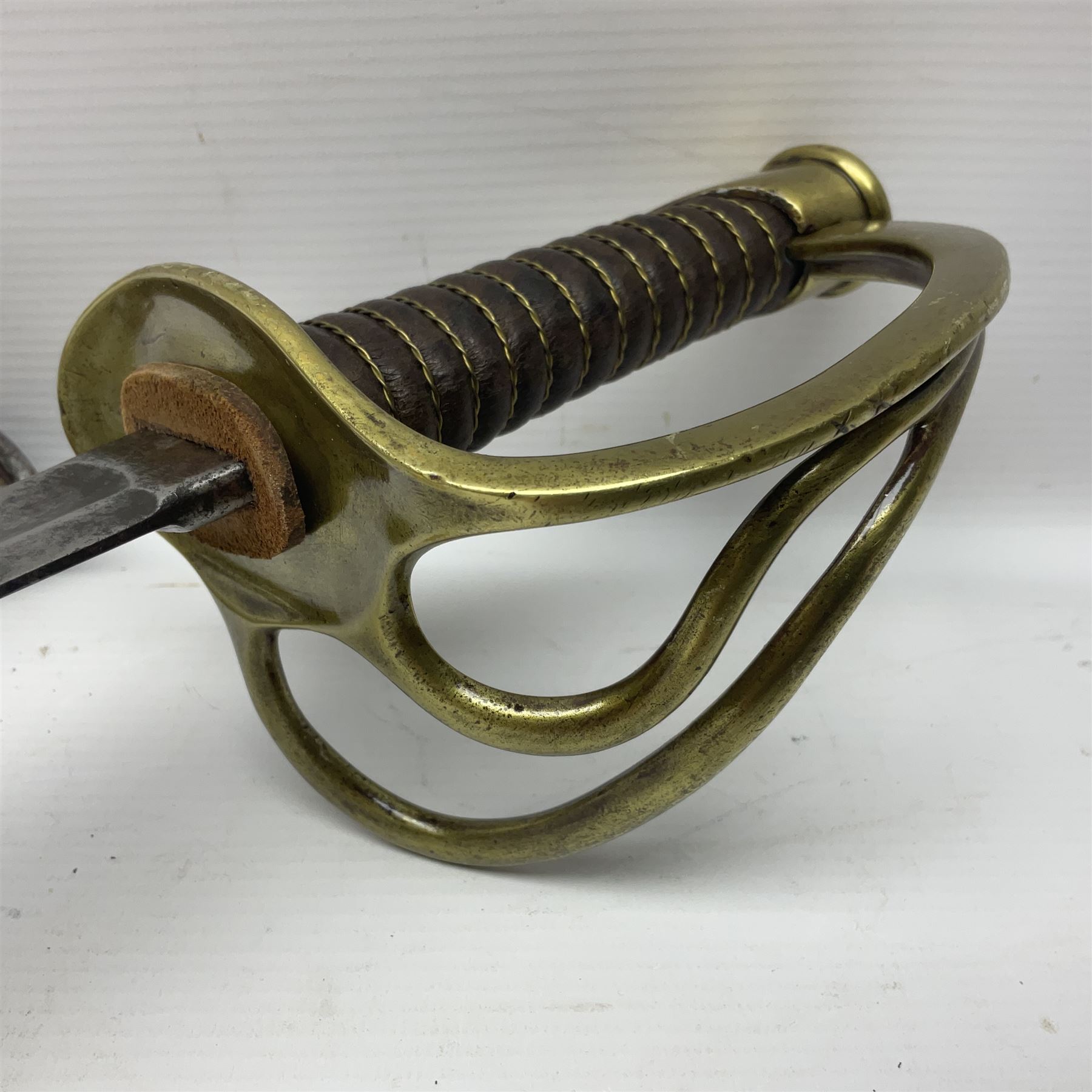 19th century French 1822 Pattern Light Cavalry trooper's sword with 88.5cm slightly curving fullered blade, brass three-bar hilt and wire-bound leather grip; in polished steel scabbard with two suspension rings L110.5cm overall