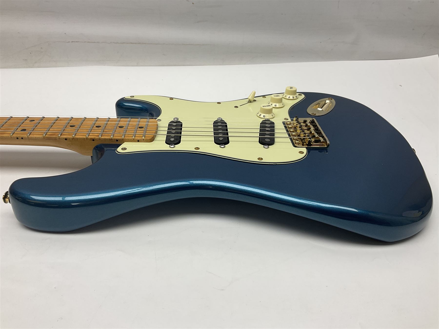 Fender Stratocaster style electric guitar in metallic blue with Rio Grande pick-ups and Fender back-plate L98cm; in Fender soft carrying case