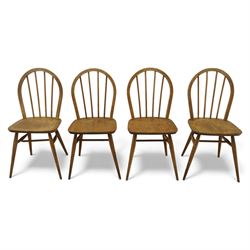 Ercol - Windsor dining chairs, set of four, each with rounded hoop back and four stick spi...