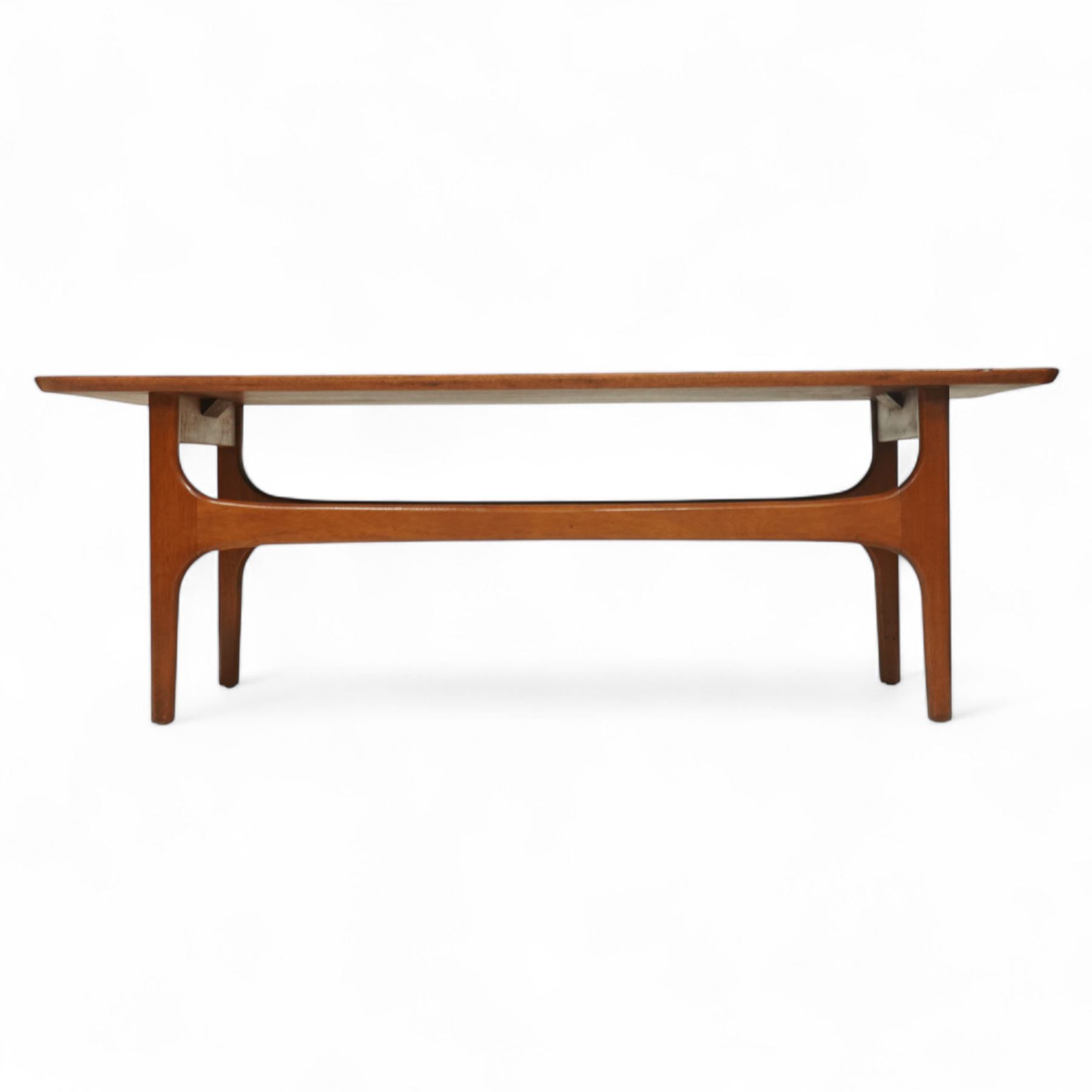 Jentique - Mid-century 'Stingray' teak coffee table, rectangular form with rounded corners, raised on shaped supports united by a magazine under tier 
