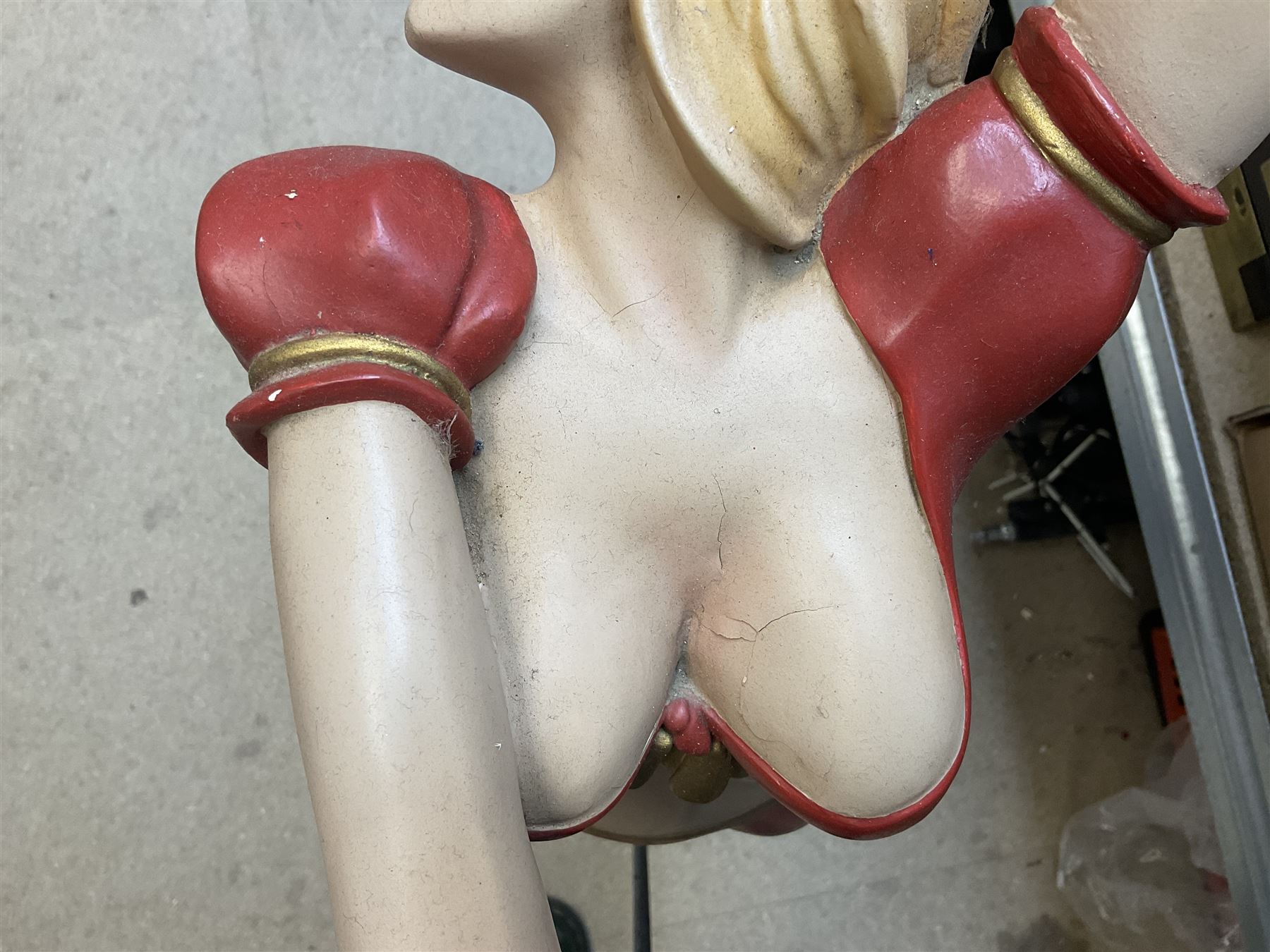 Composite Superman with cape, together with a composite female statue holding the American flag, tallest example H103cm