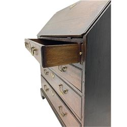Georgian oak bureau, fall front enclosing fitted interior, four long graduating drawers, on bracket feet