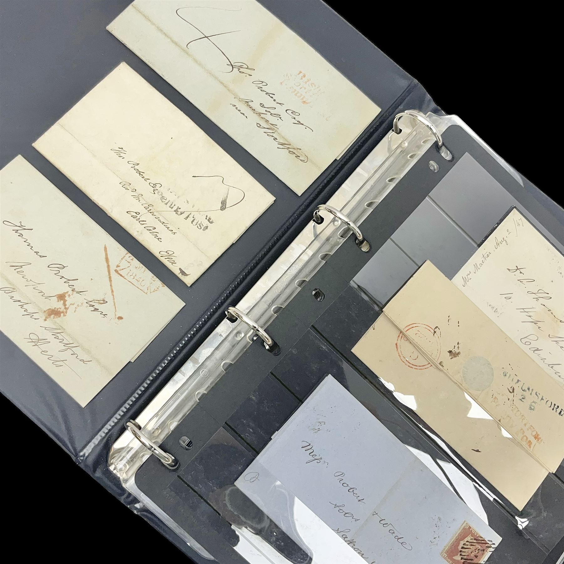 Postal history, including pre-stamp, Queen Victoria imperf penny reds on covers or entires a few with black MX cancels, 1841 two pence blue with white lines added on mourning cover, perf penny red on cover etc, housed in a ring binder folder