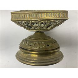 Collection of victorian and later brass desk accessories, to include a letter holder with cherub design, ink well of square form with hinged lid, brass table bell, brass casket with relief decoration, etc  