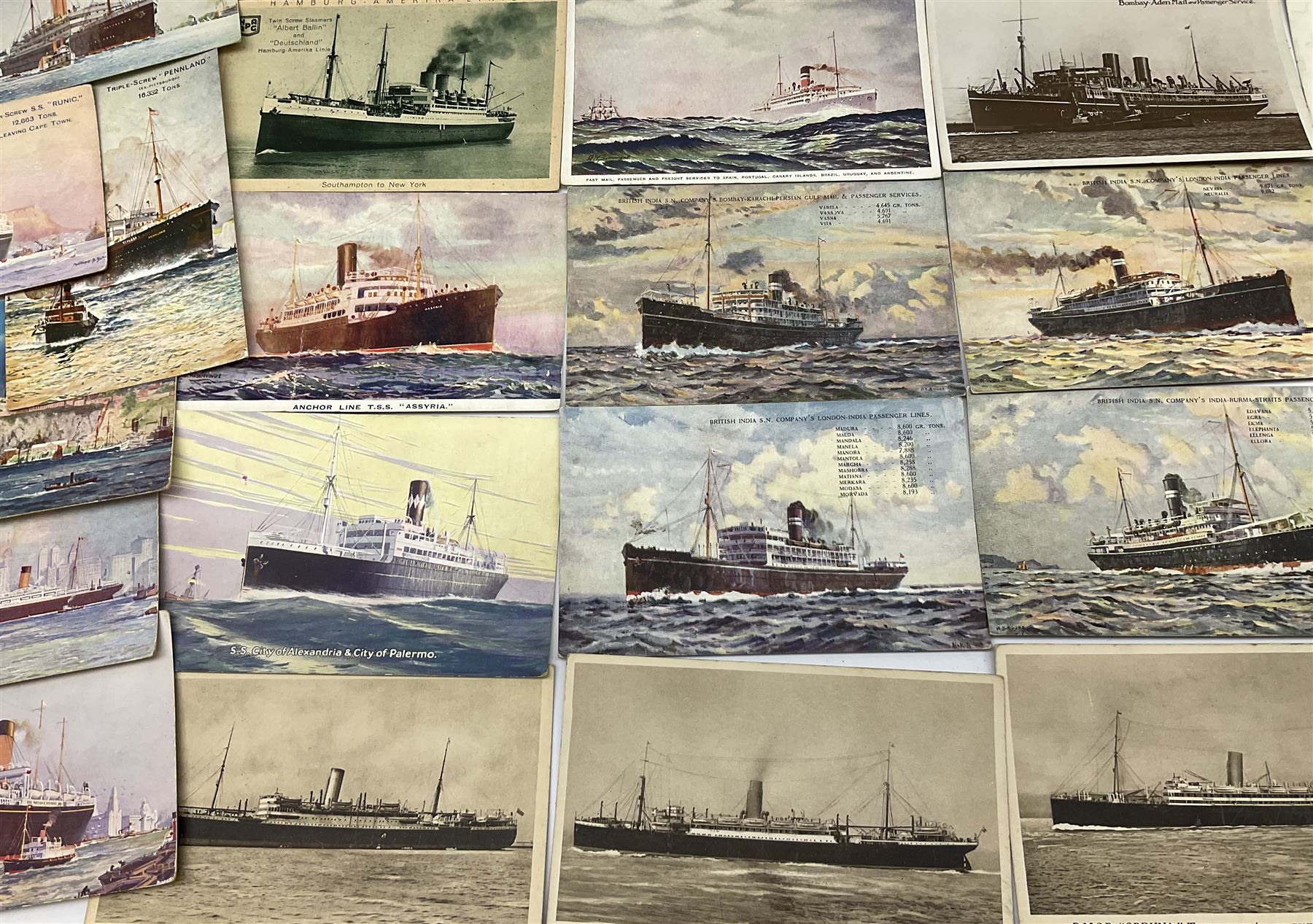Sixty-five early 20th century postcards of passenger liners including White Star, Red Star, Atlantic Transport, Anchor, Cunard, Henderson, Booth, Union Castle, Holland America, Lamport & Holt, P. & O., New Zealand, Canadian Pacific, British India etc; and ten Edwardian postcards of Naval warships and officers (75)