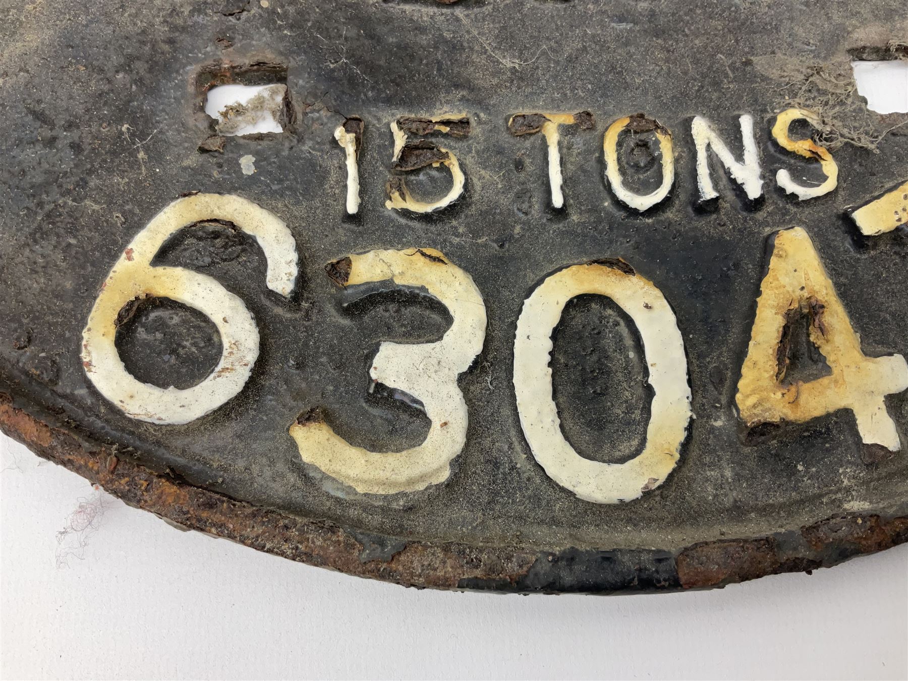 Three cast iron railway wagon plates of D shaped form to include Southern Railway, LMS and GWR, L27.5cm