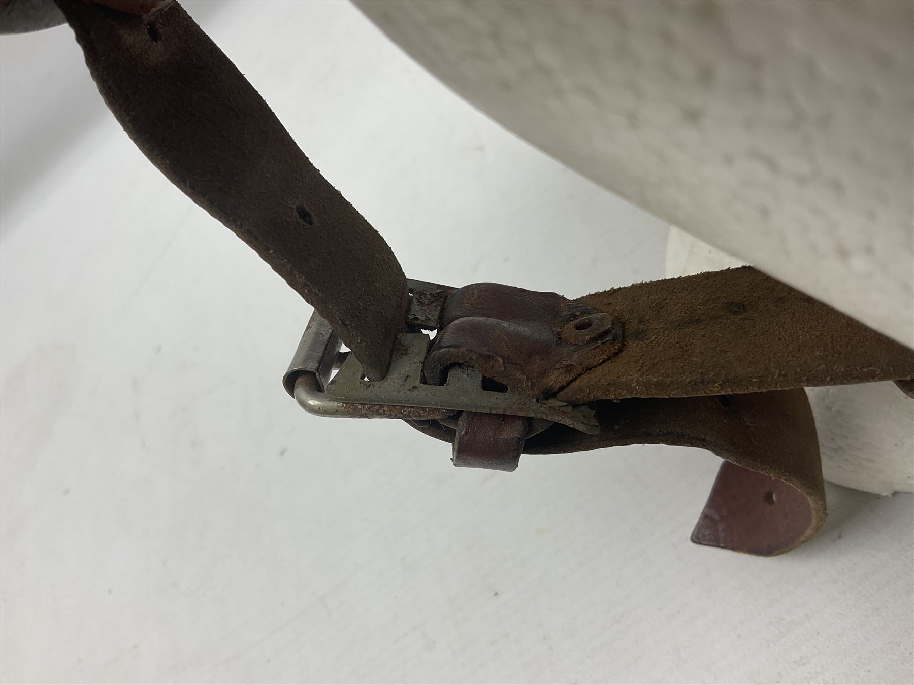 1960s Italian parachutist helmet with liner; camouflage paintwork with parachutist crest to the front